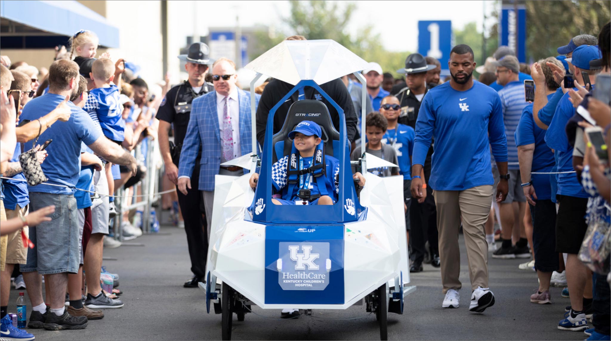 Marco leads the Cat Walk for the UK Football 2019 season opener in a parade of people.