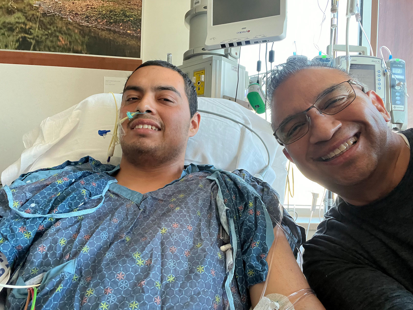 Adiel Nájera and his father take a selfie together during his hospitalization.