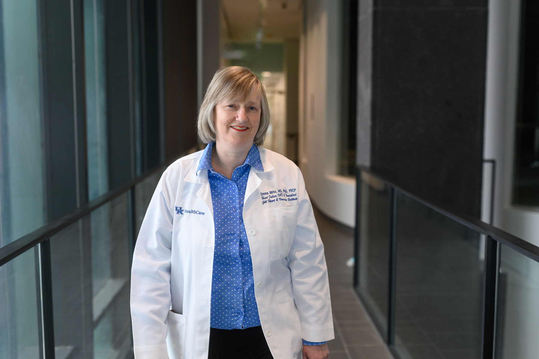 Dr. Emma Birks, a cardiologist with UK HealthCare, stands in a hallway.