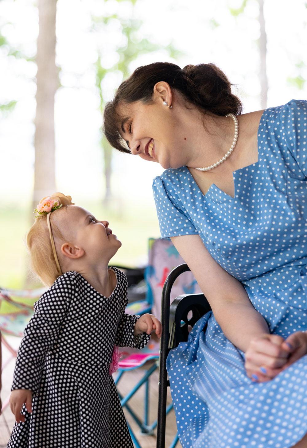 Sarah Custer, right, looks lovingly at her daughter 