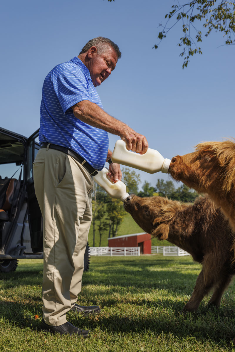 Bruce Drake feeding cows on his farm.