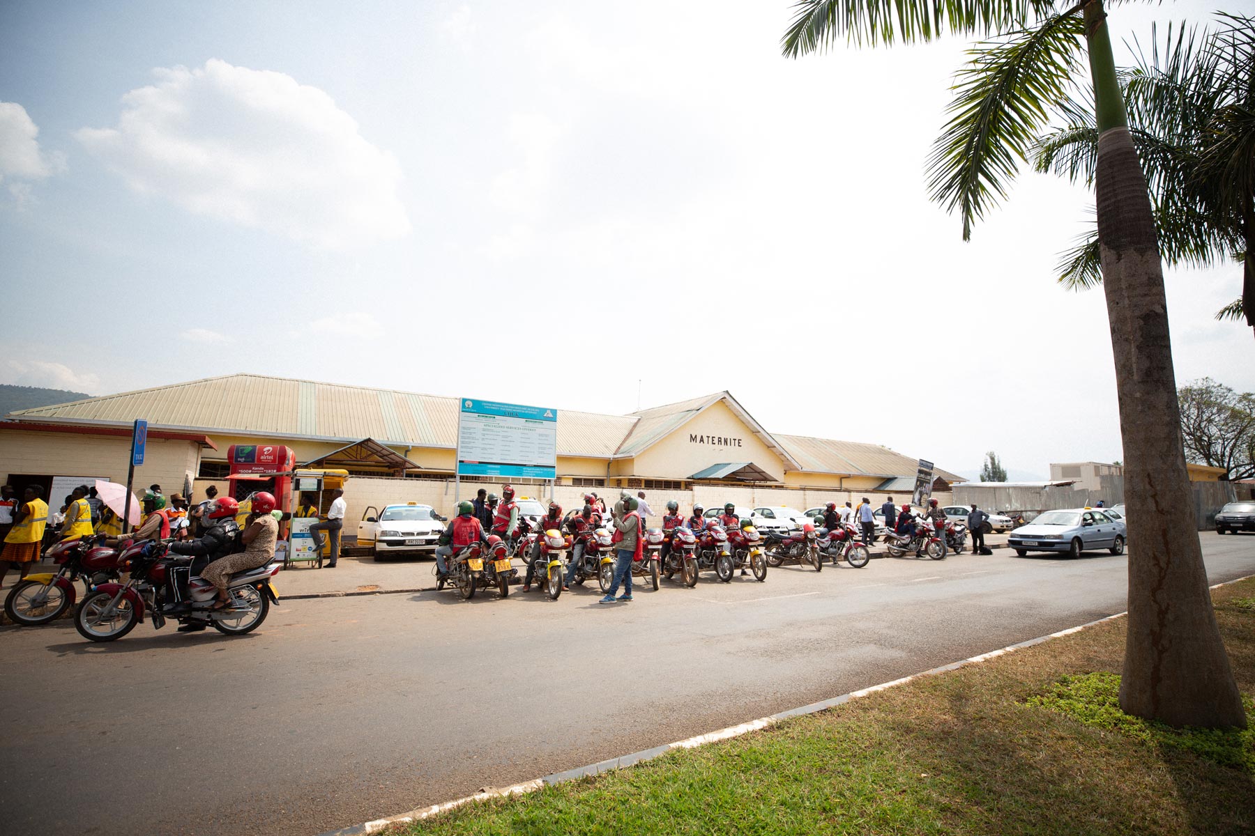 The hospital in Kigali, Rwanda where Dr. Shenoi provided training, with tons of scooters and motorcycles out front.