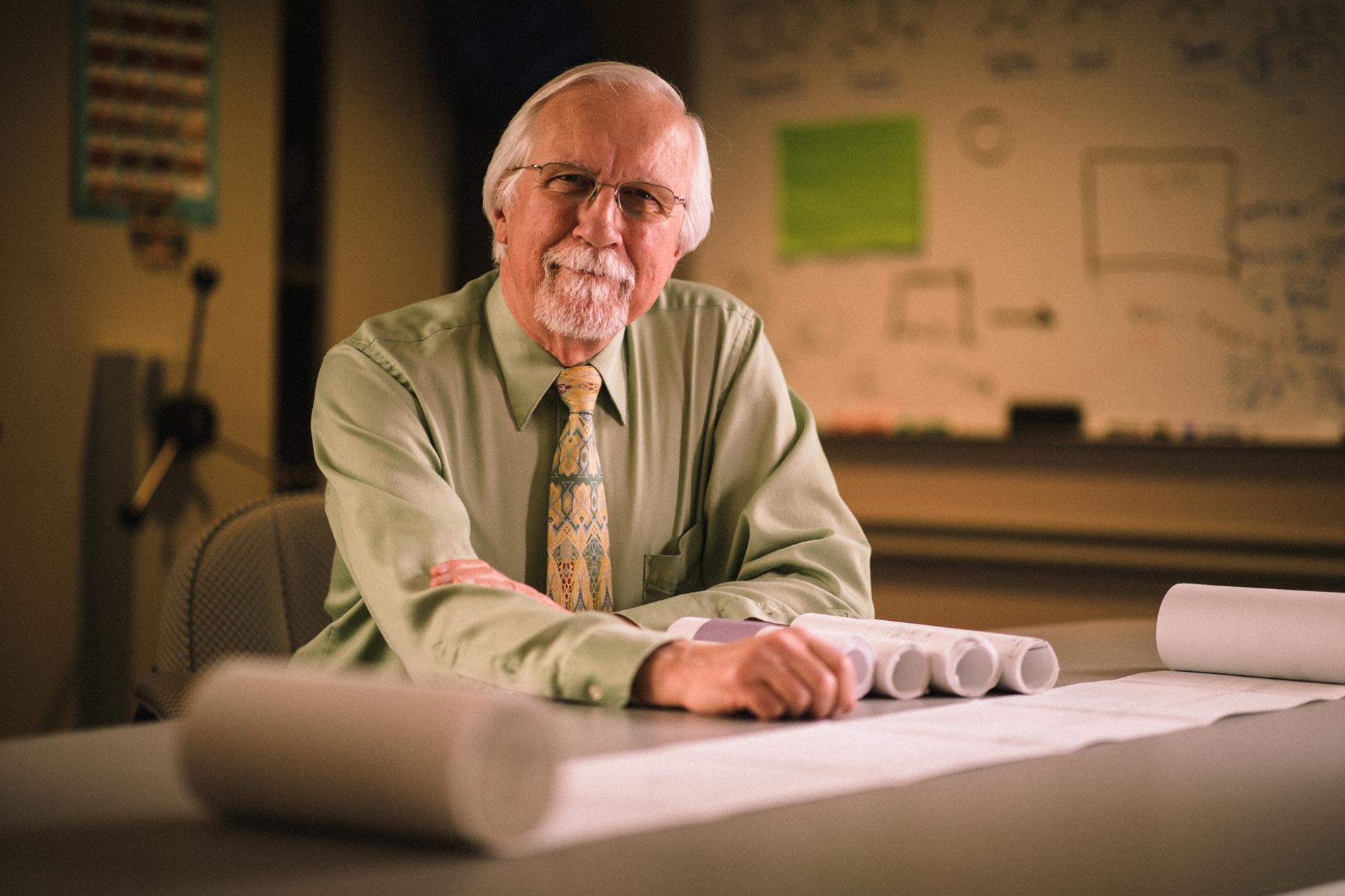 Dr. Ed Kasarskis posing with his research documents