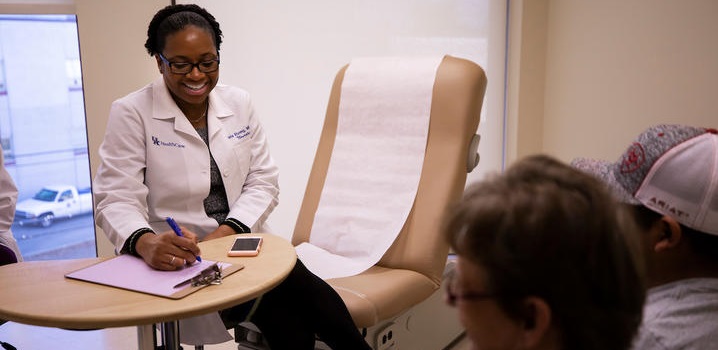 Dr. Ebong consults with a patient.