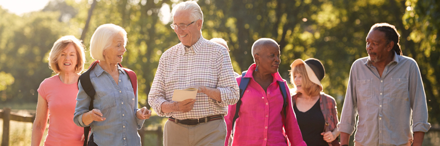 A group of seniors go walking together.