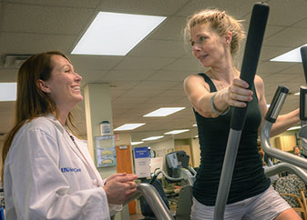 Woman on elliptical trainer