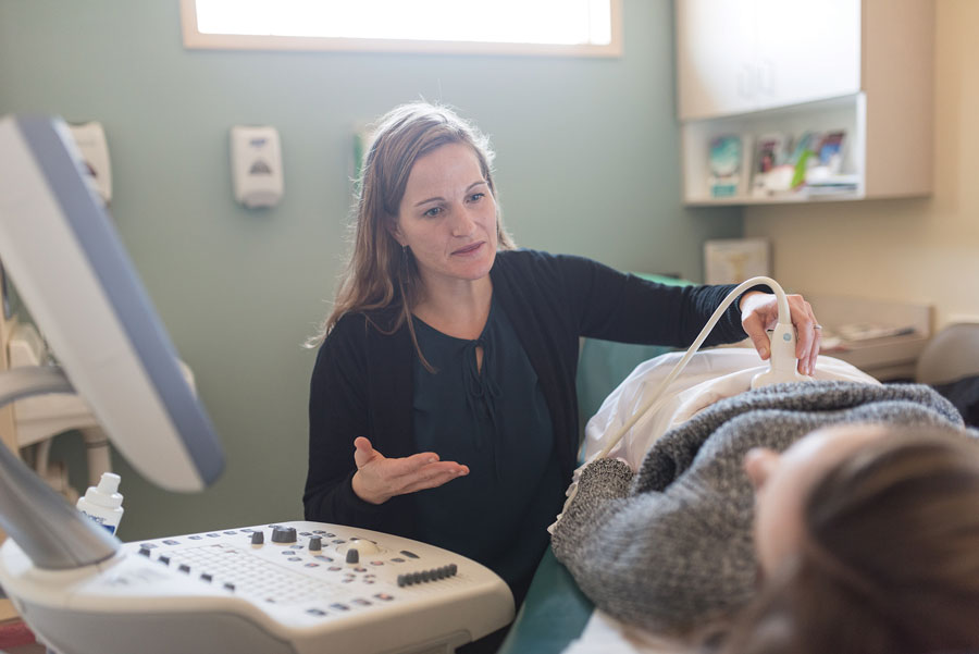 Agatha Critchfield performs an ultrasound for a PATHways patient.