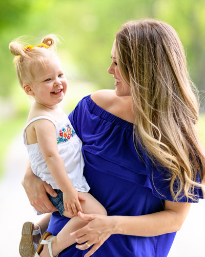Courtney holding Jade Watts.