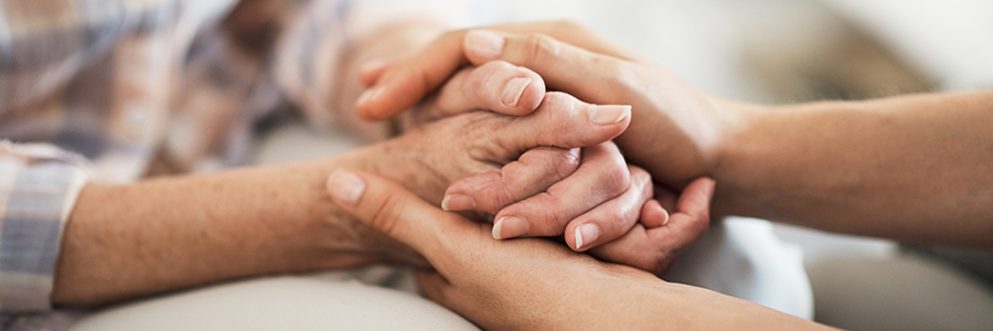 Two people holding hands