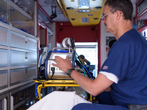 A technician is seen inside the ECMO transport unit.