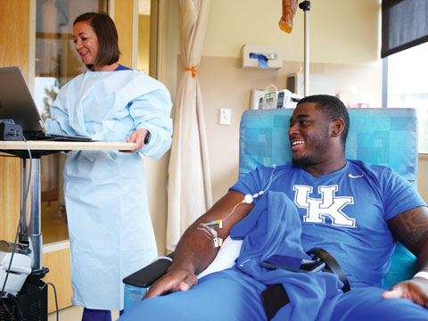 Leila Scandrani, RN, monitors the chemotherapy Josh receives.