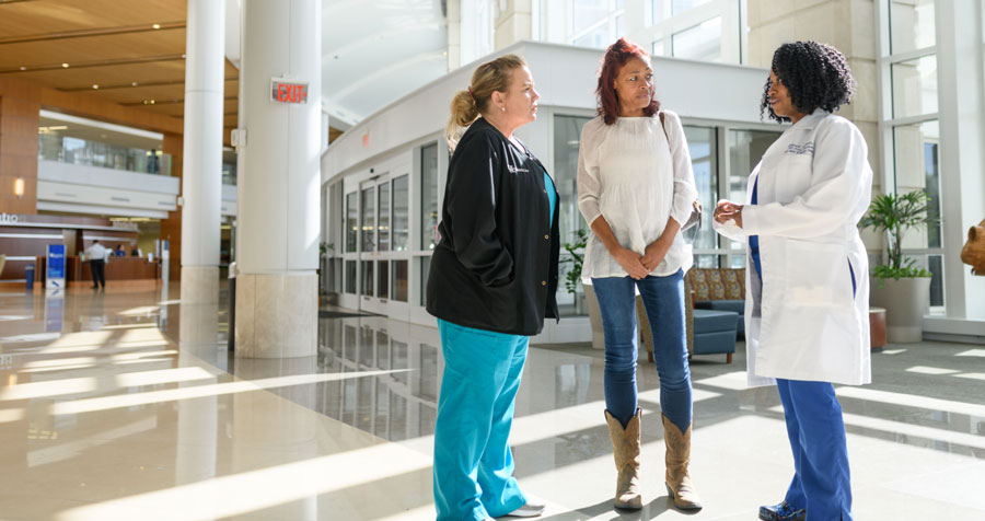 Nichole Creech talks with staff from the Gill Heart Institute.