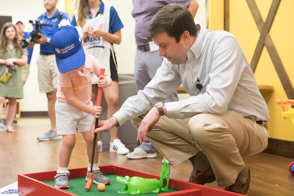 A patient putts into an "alligator" hole.