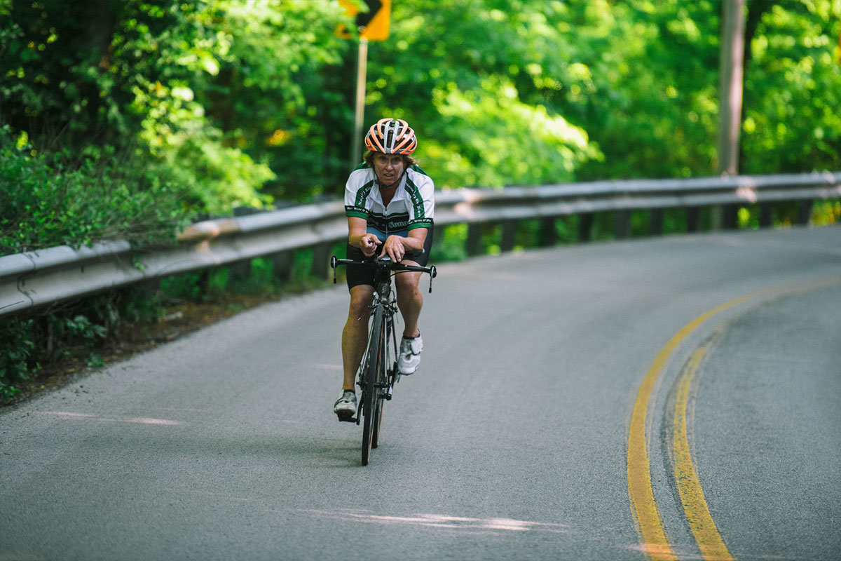 Patty Lane rides her bicycle on a country road near her home.