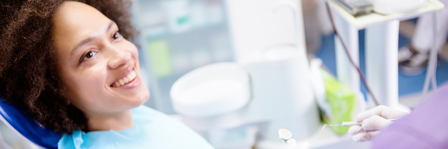 Woman smiling in a dentist's chair