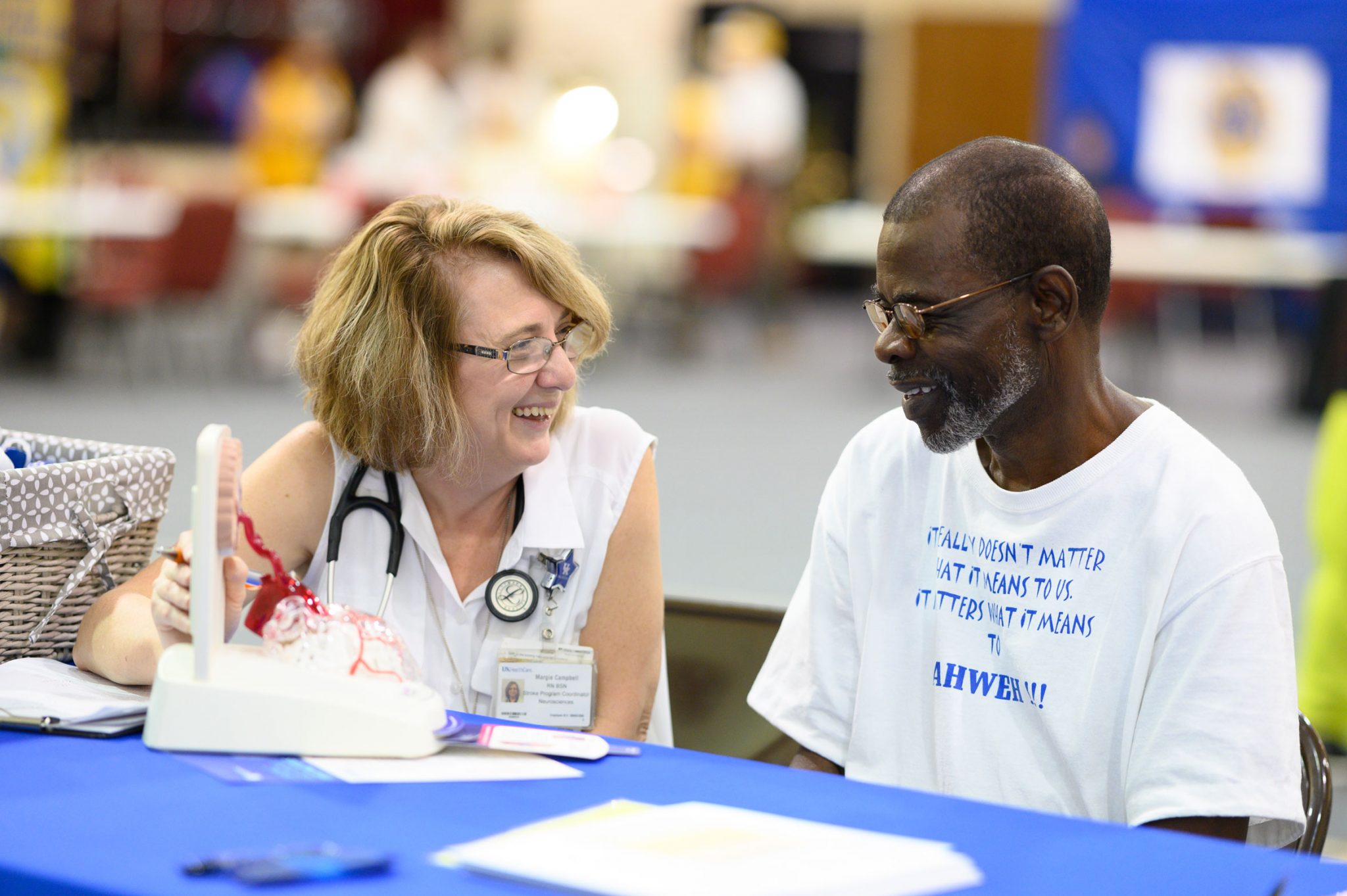 Margie educates a Kentuckian on the symptoms of stroke.