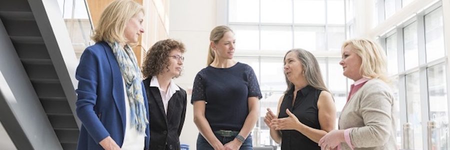 Members of Markey Women Strong talking in a group