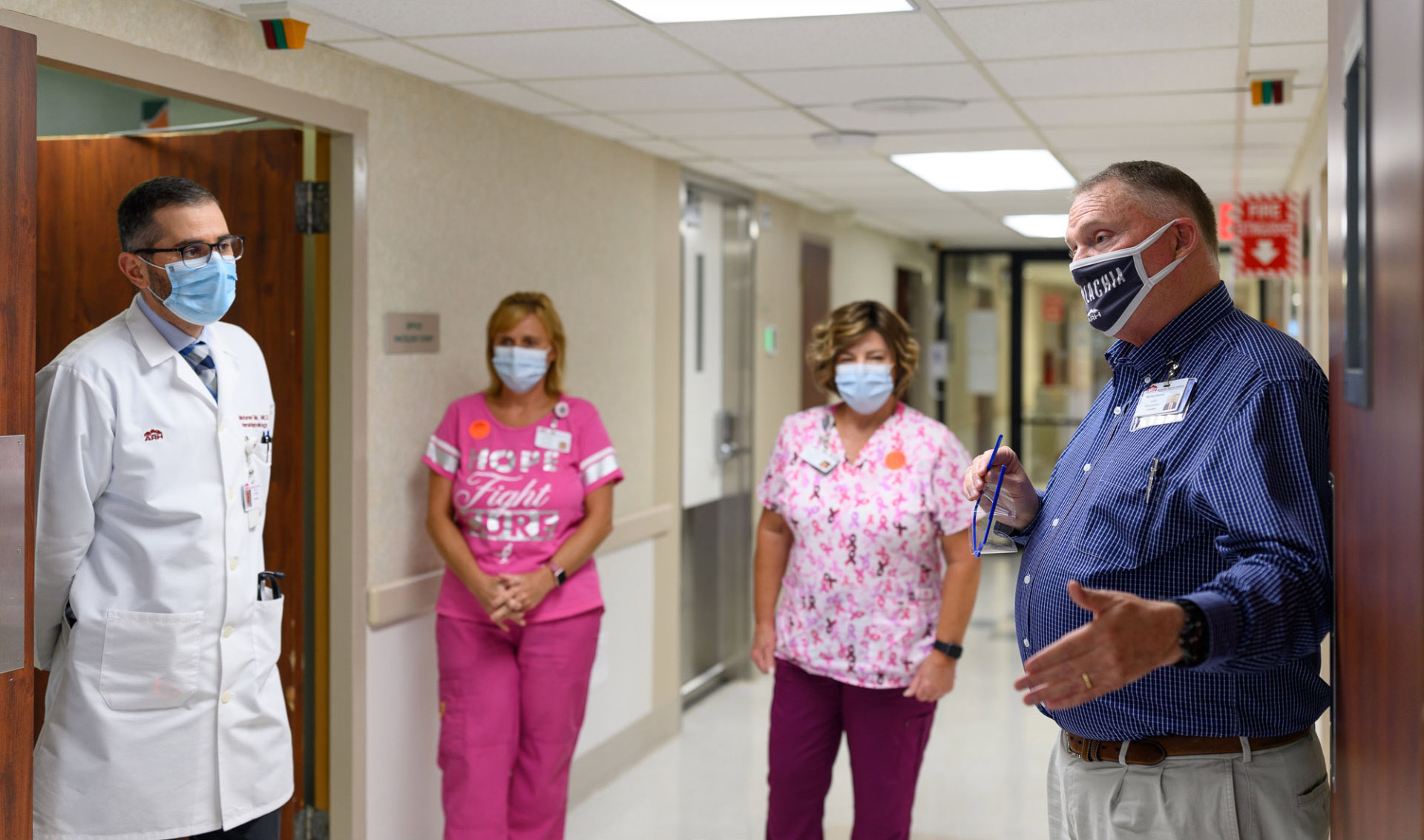 A photo of Michael speaking to Dr. Shanshal and two nurses inside Middlesboro ARH.
