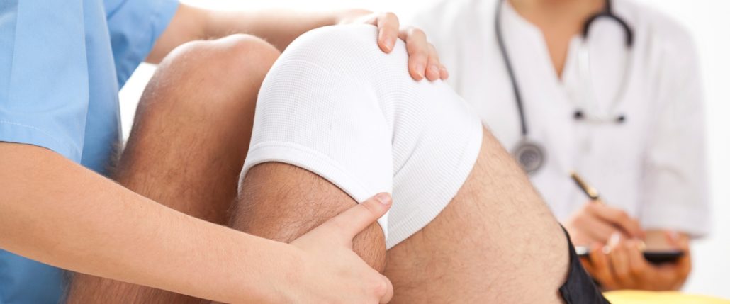 A provider manipulates a patient's knee.