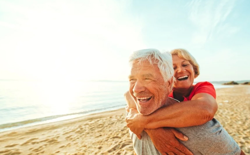 A senior couple on the beach.