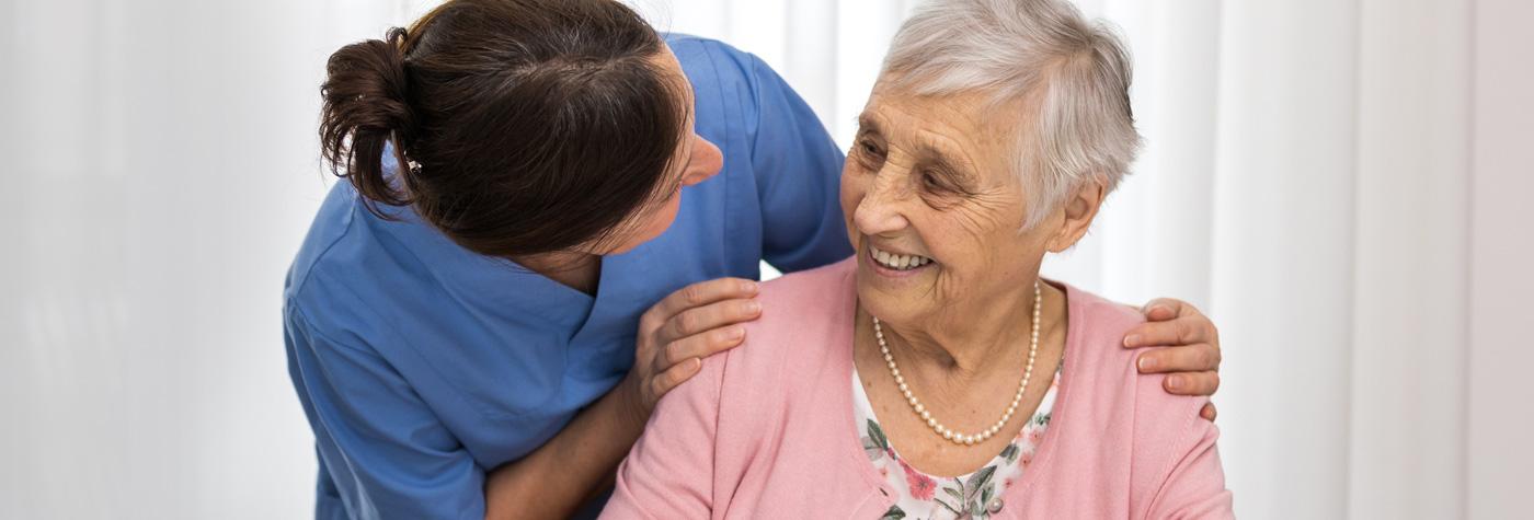 Healthcare provider with Alzheimer’s disease patient.