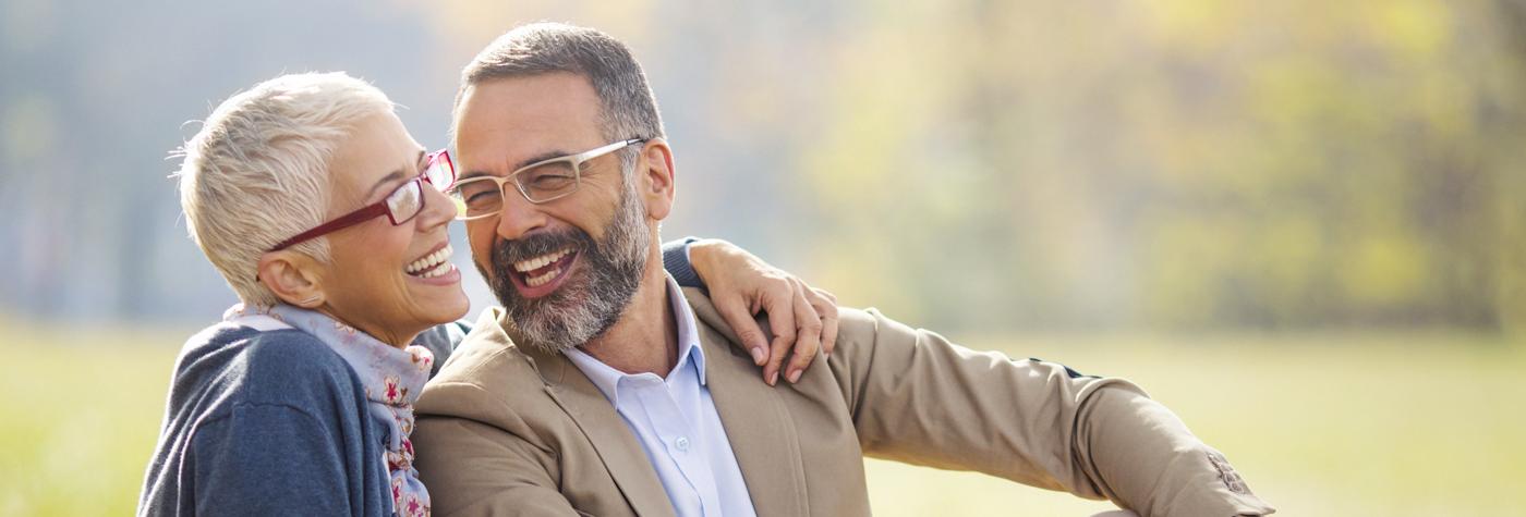 Couple with glasses relaxing outdoors