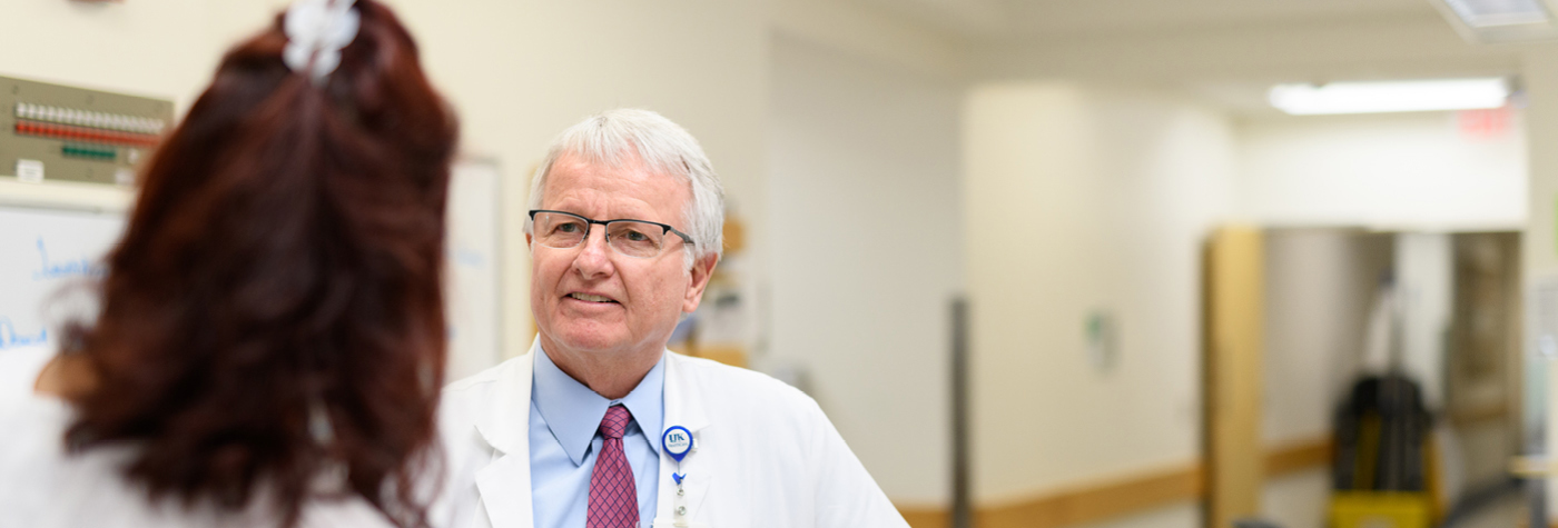Dr. David Booth talks with a patient.