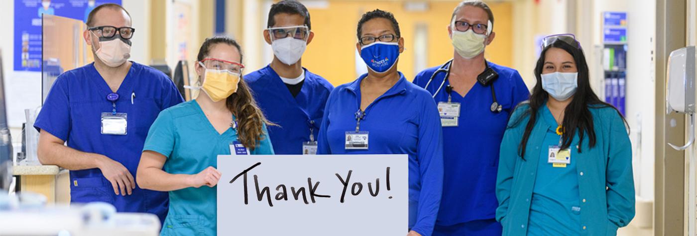 Healthcare providers with Thank You sign