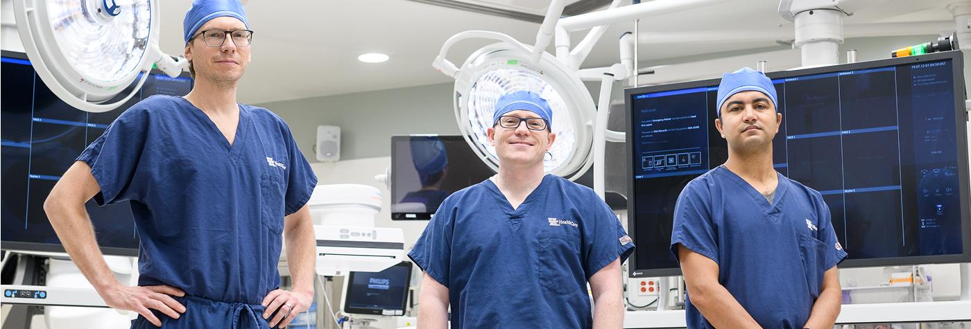 Michael Bounds, MD; Nathan Orr, MD; and Samuel Tyagi, MD are seen in the operating room.