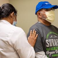 Dr. Sravanthi Nandavaram checks Raymond Cloud's breathing.