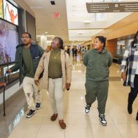 Tiona Stevenson and her family walk through a hallway at UK Albert B. Chandler Hospital.