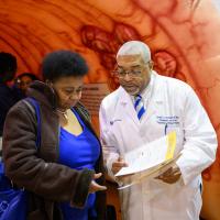 Dr. Conwell discusses services with an attendee.