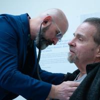 Dr. Andrew Kolodziej checks Ron Kelly's vitals during a visit at UK HealthCare.