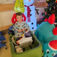 Crew Stone in a wagon during Christmas at Kentucky Children's Hospital