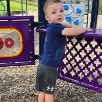 Crew Stone playing at a playground.