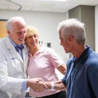 Joe and Cathy Marksteiner greeting Dr. Lowell Anthony, a specialist at Markey Cancer Center