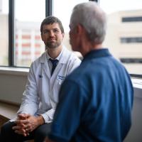 UK HealthCare Markey Cancer Center surgical oncologist Dr. Michael Cavnar discussing treatment options with Joe Marksteiner