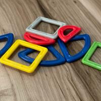 A pile of multicolored, geometric magnetic toys, similar to the ones Kristen took apart.