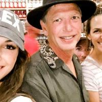 A candid selfie of Gary and his children inside a store. His daughters are on both sides of him, with Maxx peeking through the background.