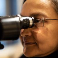 Dr. Capoor looks through a slit lamp.