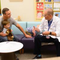 Dr. Maul chats with Ezra and Arlo's dad.