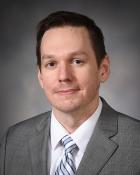Dr. Christopher R. Simmons