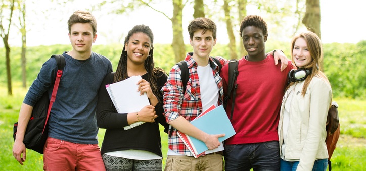 Group of teens standing and smiling