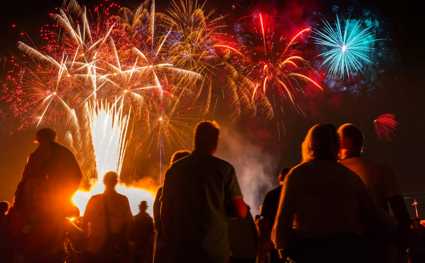 People watch a fireworks show.