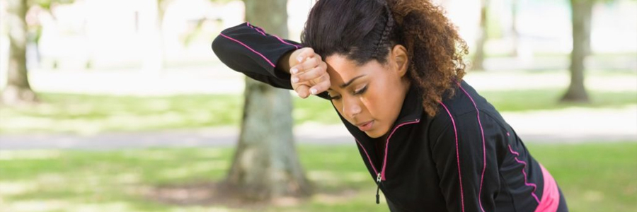 A woman is affected by summer heat.